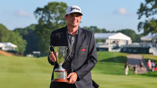 Keegan Bradley poses with the trophy after winning the 2023 Travelers Championship at TPC River Highlands in Cromwell, Connecticut. (Vincent Carchietta-USA TODAY Sports)