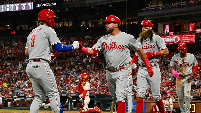 Philadelphia Phillies DH Kyle Schwarber daps up 1B Bryce Harper after a three-run home run vs. the St. Louis Cardinals at Busch Stadium. (Jeff Curry-USA TODAY Sports)