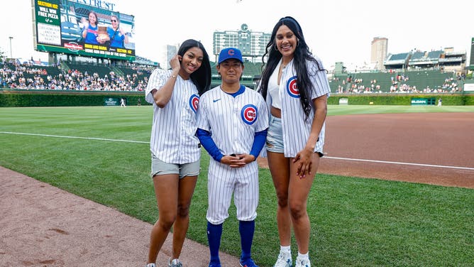 Chicago Sky PF Angel Reese and C Kamilla Cardoso pose with Cubs pitcher Shota Imanaga before throwing out the first pitch at Wrigley Field. (Kamil Krzaczynski-USA TODAY Sports)