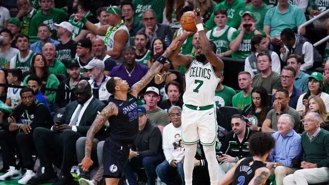 Celtics SF Jaylen Brown shoots a three over Dallas Mavericks PF P.J. Washington in Game 1 of the 2024 NBA Finals at TD Garden in Boston. (David Butler II-USA TODAY Sports)