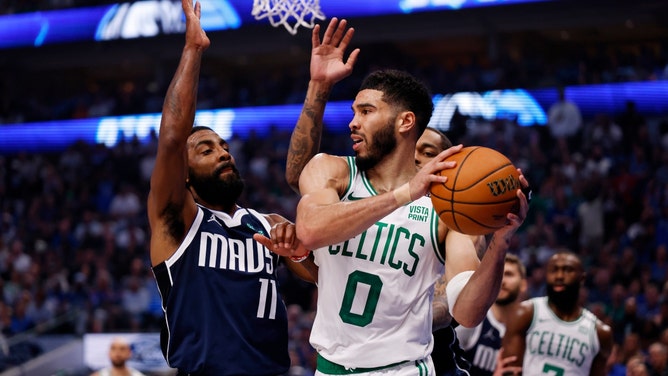 Boston Celtics All-Star Jayson Tatum looks to pass while Mavericks SG Kyrie Irving is playing defense in Game 4 of the 2024 NBA Finals at American Airlines Center in Dallas. (Peter Casey-USA TODAY Sports)