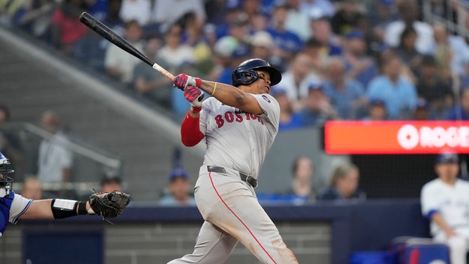 Boston Red Sox 3B Rafael Devers hits a double against the Toronto Blue Jays at Rogers Centre in Canada. (John E. Sokolowski-USA TODAY Sports)
