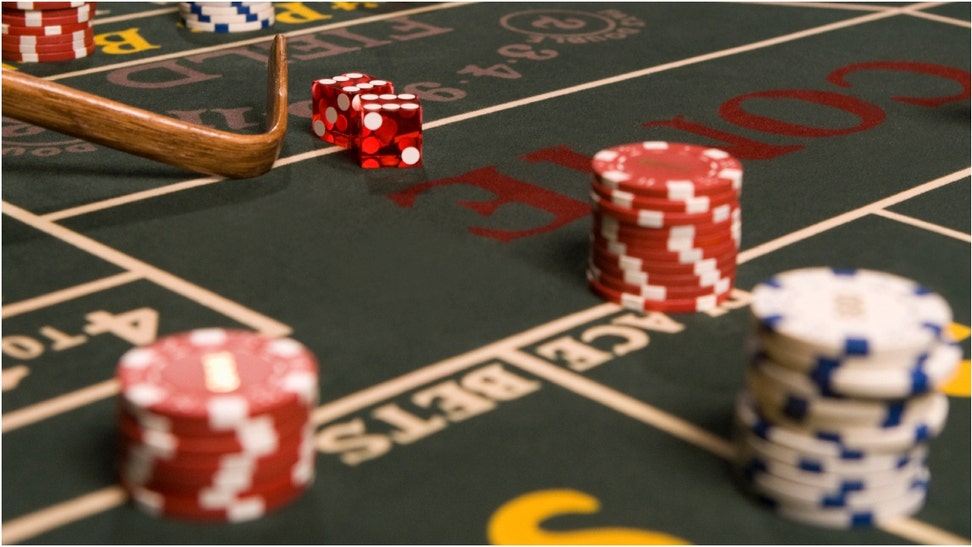 A man is going viral for flipping out at a casino at a craps table. Watch the crazy video. What sparked the chaos? Where did it happen? (Credit: Getty Images)