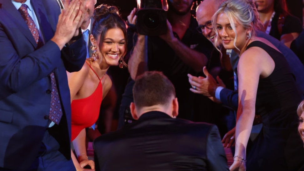 UConn stud Donovan Clinghan was drafted seventh overall by Portland this week, but his girlfriend stole the show.