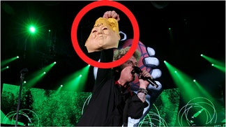 Green Day singer Billie Joe Armstrong was slammed for holding up a fake head of Donald Trump during a concert. Check out the reactions. (Credit: Getty Images)