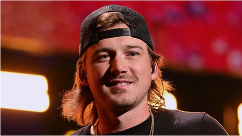 Morgan Wallen hit by phone during concert in Denver. (Credit: Getty Images)