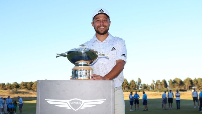 Xander Schauffele poses with the trophy after winning the 2022 Genesis Scottish Open. (Andrew Redington/Getty Images)
