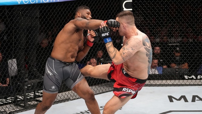 Curtis Blaydes and Tom Aspinall of England trade strikes in a heavyweight bout during the UFC Fight Night event at O2 Arena in London, England. (Jeff Bottari/Zuffa LLC)
