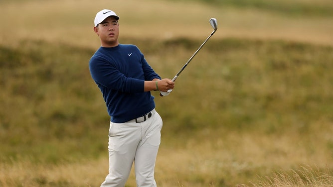 Tom Kim plays a shot from the rough in a practice round for The 152nd Open Championship. (Harry How/Getty Images)
