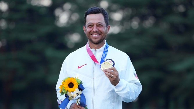 Xander Schauffele on the podium after winning the gold medal at the 2020 Tokyo Summer Olympics at Kasumigaseki Country Club in Japan. (Kyle Terada-USA TODAY Sports)