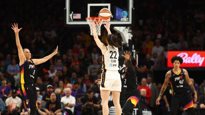 Indiana Fever rookie Caitlin Clark chucking a three over Phoenix Mercury SG Diana Taurasi at the Footprint Center in Arizona. (Mark J. Rebilas-USA TODAY Sports)