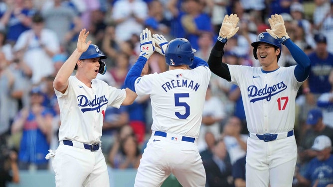 Los Angeles Dodgers 1B Freddie Freeman celebrates a three-run home run with C Will Smith and DH Shohei Ohtani vs. the Arizona Diamondbacks at Dodger Stadium. (Kirby Lee-USA TODAY Sports)