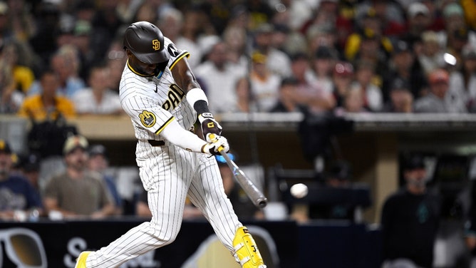 San Diego Padres OF Jurickson Profar hits an RBI double vs. the Arizona Diamondbacks at Petco Park. (Orlando Ramirez-USA TODAY Sports)