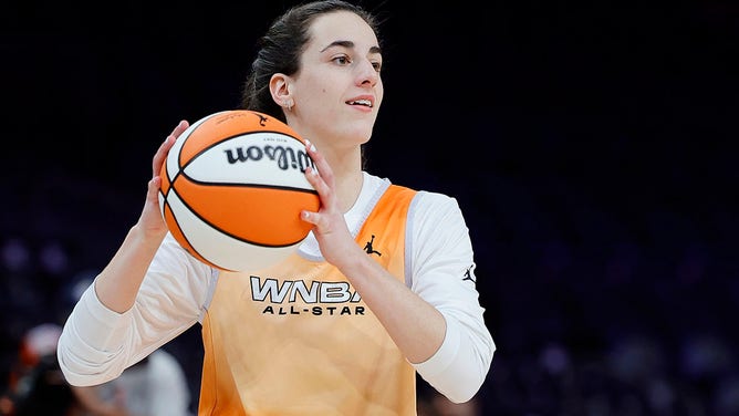 Caitlin Clark of Team WNBA looks to pass the ball during a WNBA All-Star Game team practice.