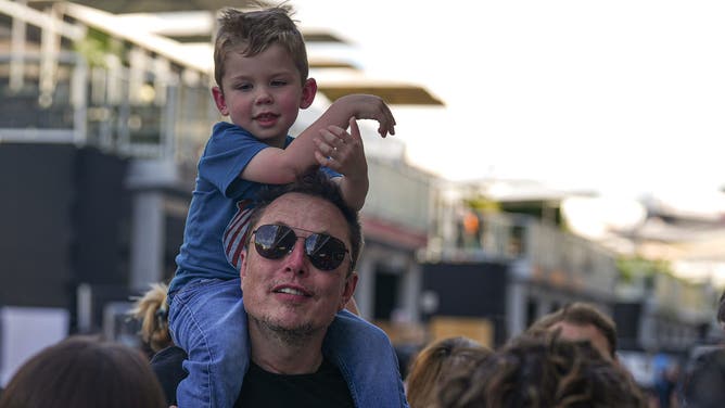 Elon Musk with his son, X Æ A-12, on his shoulders.