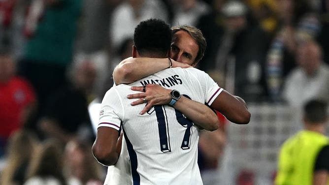 England forward Ollie Watkins is congratulated by England's head coach Gareth Southgate after winning the UEFA Euro 2024 semi-final football match between the Netherlands and England. 