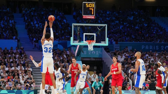 France C Victor Wembanyama shoots a three against Team Germany in the 2024 Paris Summer Olympics. (Garrett Ellwood/NBAE via Getty Images)
