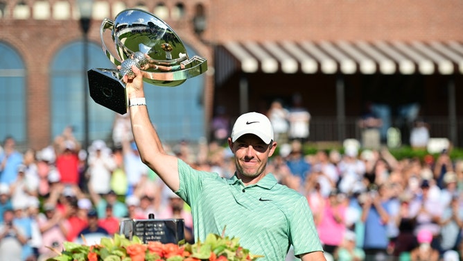 Rory McIlroy holds up the FedEx Cup trophy after winning the 2022 TOUR Championship at East Lake Golf Club in Atlanta, Georgia. (Adam Hagy-USA TODAY Sports)