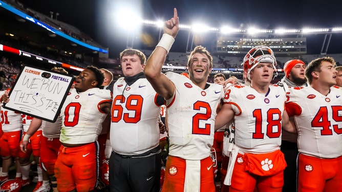 Clemson Tigers QB Cade Klubnik celebrates with teammates after beating the South Carolina Gamecocks at Williams-Brice Stadium. (Jeff Blake-USA TODAY Sports)