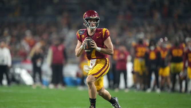 USC Trojans QB Miller Moss rolls out to pass vs. the Louisville Cardinals in the Holiday Bowl at Petco Park in San Diego. (Kirby Lee-USA TODAY Sports)