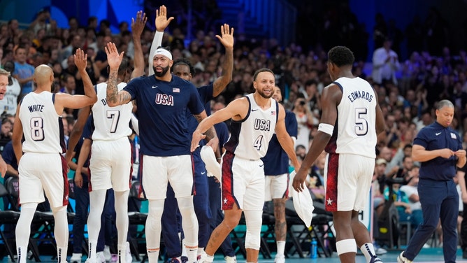 American guards Stephen Curry and Anthony Edwards celebrate after a time out vs. South Sudan during the Paris Summer Olympics. (John David Mercer-USA TODAY Sports) 