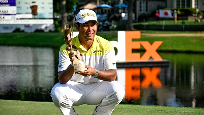 Hideki Matsuyama poses with the trophy after winning the 2024 FedEx St. Jude Championship golf tournament at TPC Southwind in Memphis, Tennessee. )Steve Roberts-USA TODAY Sports)