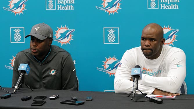 Miami Dolphins GM Chris Grier (left) and former head coach Brian Flores (right) reportedly didn't get along when they worked together for the team.