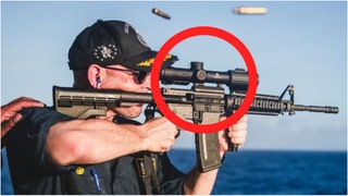 Navy commander responsible for embarrassing rifle photo relieved of duty. (Credit: Screenshot/United States Navy)