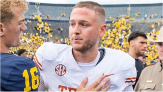 Quinn Ewers is going viral for his reaction during an awkward interaction with a young Michigan fan. The kid threw up the horns down sign. Watch a video of the moment. (Credit: Getty Images)