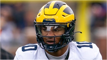 Michigan coach Sherrone Moore apparently didn't tell players about making a QB switch from Davis Warren to Alex Orji. They found out from the media. (Credit: Getty Images)
