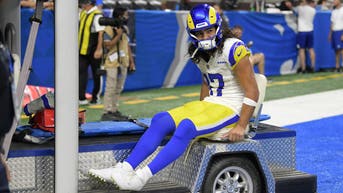 Sep 8, 2024; Detroit, Michigan, USA; Los Angeles Rams wide receiver Puka Nacua (17) is carted off the field after being injured against the Detroit Lions in the first half at Ford Field. Mandatory Credit: Lon Horwedel-Imagn Images
