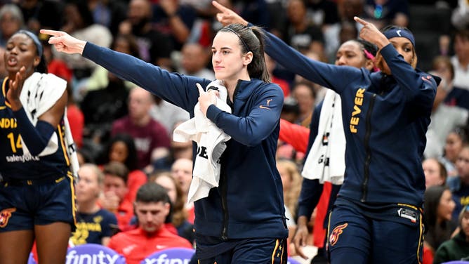 WASHINGTON, DC - SEPTEMBER 19: Caitlin Clark #22 of the Indiana Fever watches the game in the third quarter against the Washington Mystics at Capital One Arena on September 19, 2024 in Washington, DC. NOTE TO USER: User expressly acknowledges and agrees that, by downloading and or using this photograph, User is consenting to the terms and conditions of the Getty Images License Agreement. (Photo by Greg Fiume/Getty Images)