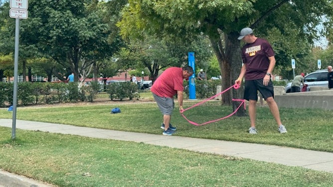 Oklahoma fans measure out their space for the tailgate area, preparing for Saturdays game against Tennessee Via: Trey Wallace