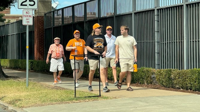 Tennessee fans take a stroll around the Oklahoma campus before the game on Saturday. 