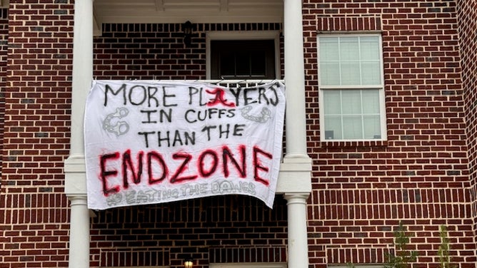 Alabama fans had fun with banners, as Georgia makes it way into town for a massive college football matchup