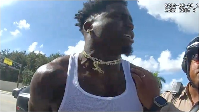 Zach Bryan trolls Tyreek Hill. (Credit: Miami-Dade Police body camera)