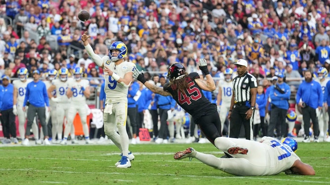 Los Angeles Rams QB Matthew Stafford throws a touchdown while under pressure against the Arizona Cardinals at State Farm Stadium. (Joe Camporeale-Imagn Images)