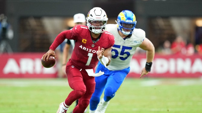 Arizona Cardinals QB Kyler Murray runs by Los Angeles Rams DT Braden Fiske at State Farm Stadium. (Joe Camporeale-Imagn Images)