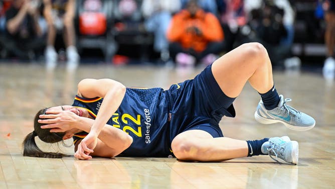 Indiana Fever guard Caitlin Clark (22) reacts to a foul in the first quarter during game one of the first round of the 2024 WNBA Playoffs at Mohegan Sun Arena. Mandatory Credit: Mark Smith-Imagn Images