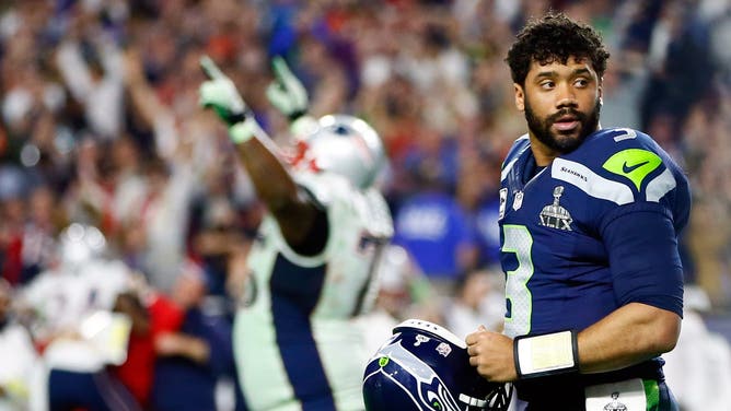 Russell Wilson of the Seattle Seahawks looks on after his pass is intercepted by Malcolm Butler of the New England Patriots late in the fourth quarter during Super Bowl XLIX at University of Phoenix Stadium on February 1, 2015.