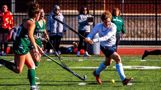 Ryan Crook (right) is a boy who plays on the girls' field hockey team at Somerset-Berkley high school in Massachusetts.