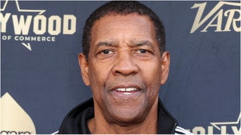 Denzel Washington gets into tense moment with the paparazzi. (Credit: Getty Images)