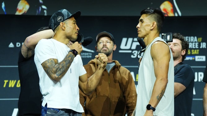 Jose Aldo and Mario Bautista face off during the UFC 307 press conference at Salt Palace Convention Center in Utah. (Photo by Jeff Bottari/Zuffa LLC)
