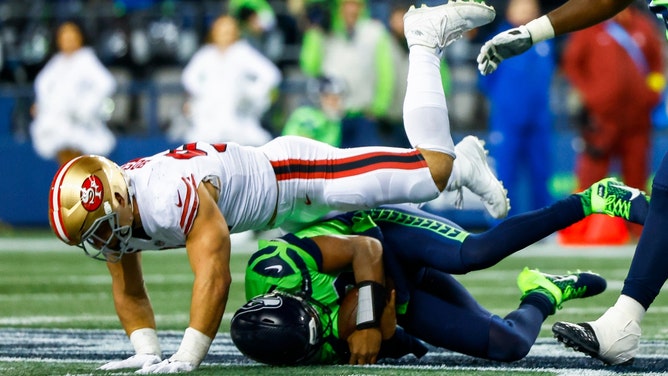 San Francisco 49ers pass rusher Nick Bosa sacks Seattle Seahawks QB Geno Smith. (Joe Nicholson-Imagn Images)