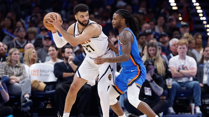 Denver Nuggets PG Jamal Murray posts up Oklahoma City Thunder SG Cason Wallace at Paycom Center. (Alonzo Adams-Imagn Images)
