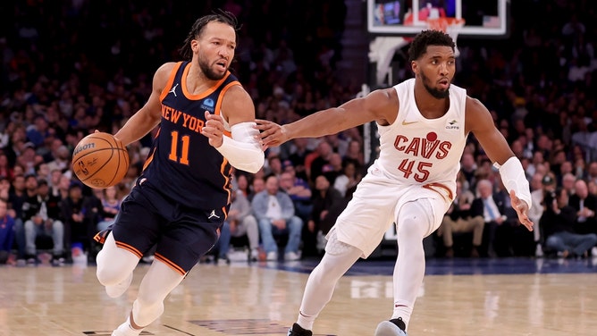 New York Knicks PG Jalen Brunson drives past Cleveland Cavaliers All-Star Donovan Mitchell at Madison Square Garden. (Brad Penner-Imagn Images)
