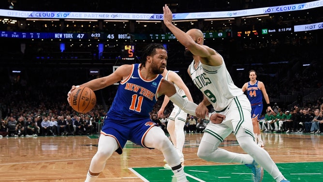 New York Knicks PG Jalen Brunson dribbles the ball on the baseline with Boston Celtics SG Derrick White played defense at TD Garden. (Bob DeChiara-USA TODAY Sports)