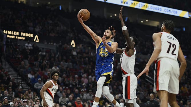 Golden State Warriors All-Star Stephen Curry gets a layup vs. the Portland Trail Blazers at Moda Center in Oregon. (Troy Wayrynen-USA TODAY Sports)