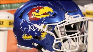 Security lit up a fan after Kansas beat Colorado. Watch a video of the fan being tackled. (Credit: Getty Images)