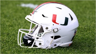 Miami player throws fan's phone after losing to Georgia Tech. (Credit: Getty Images)